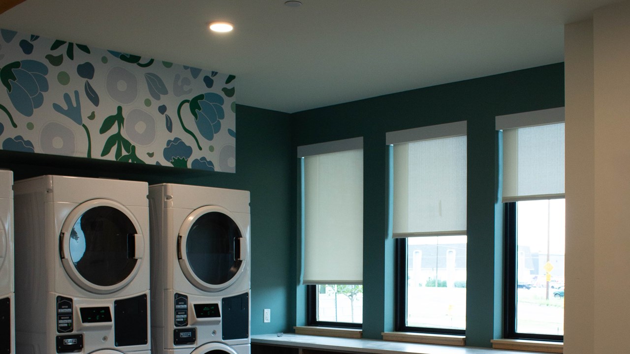 Manual roller shades in the laundry room of Marshall Homes