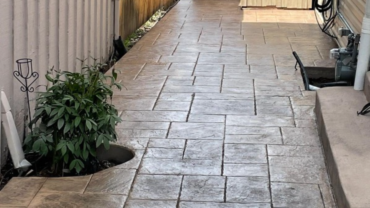 Stamped concrete walkway installation.