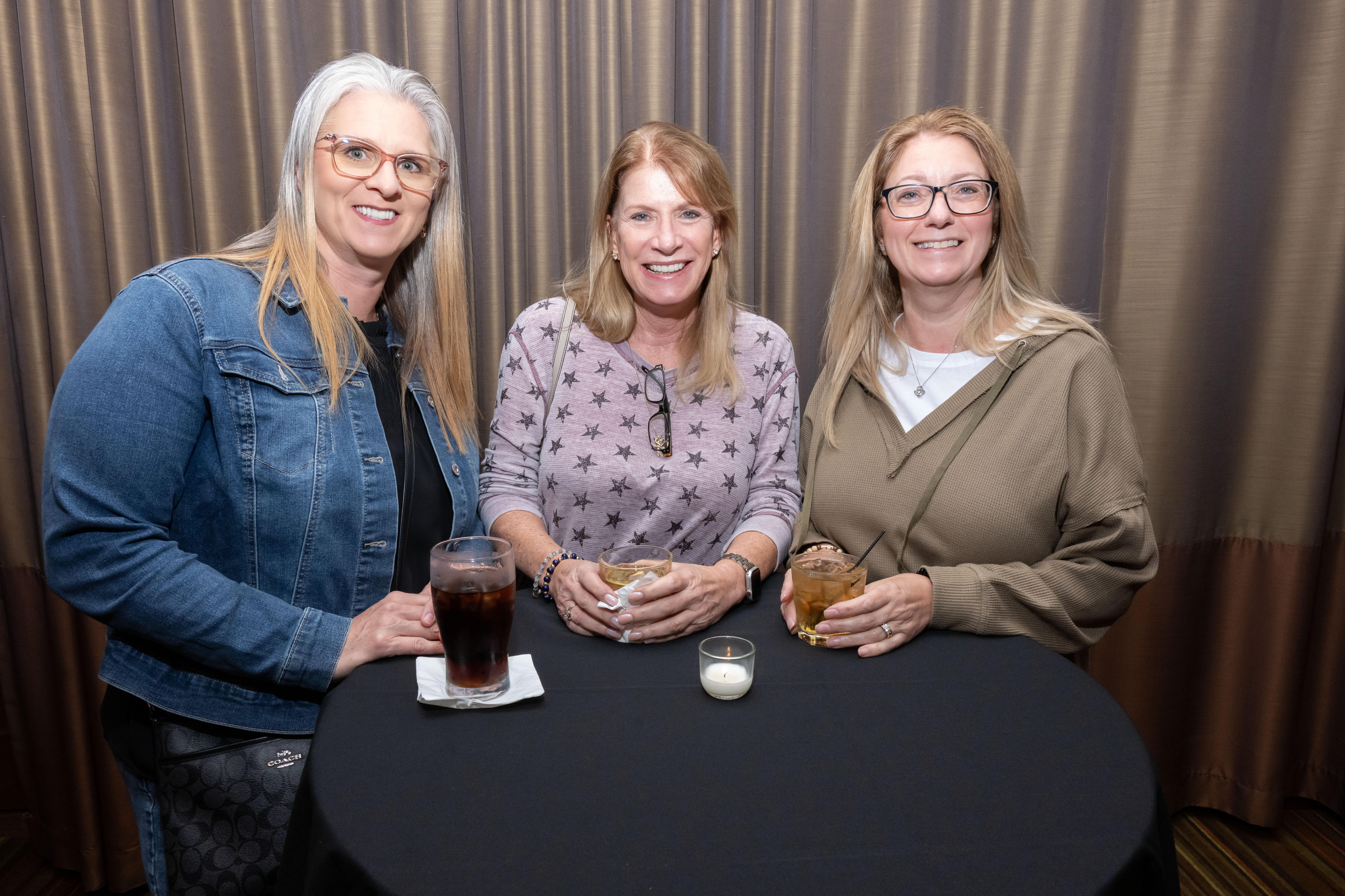 Three attendees smiling (Day 1)