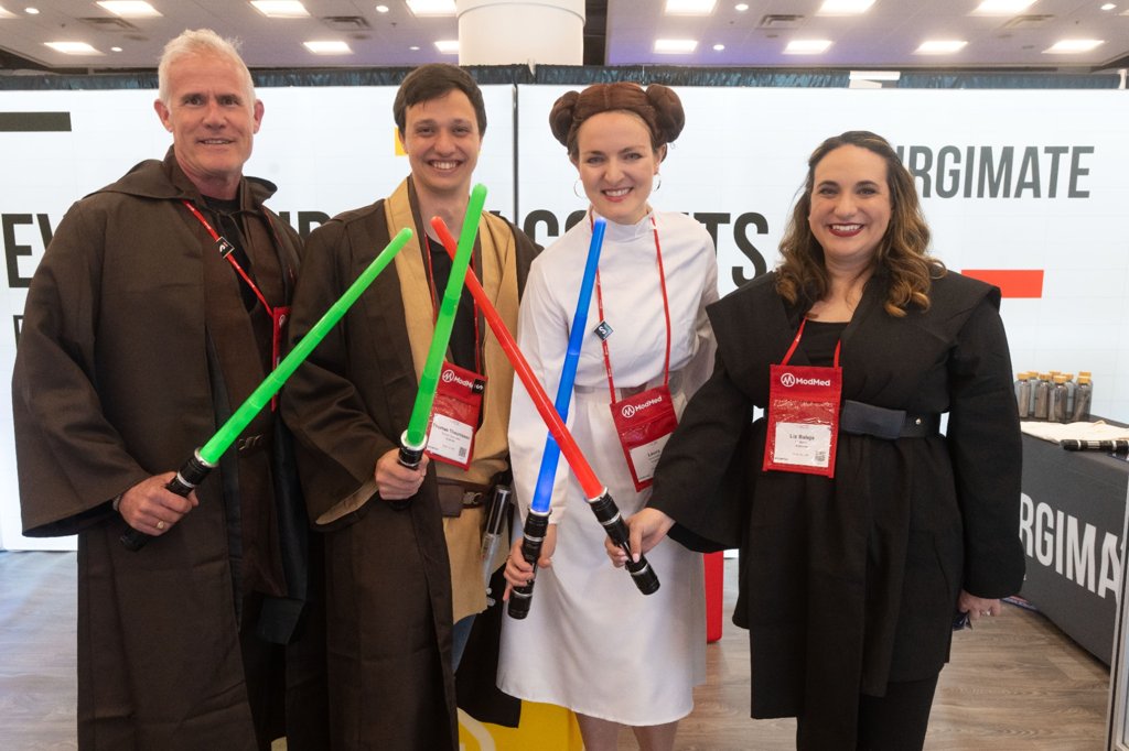 Attendees in Star Wars costumes with lightsabers (Day 3)