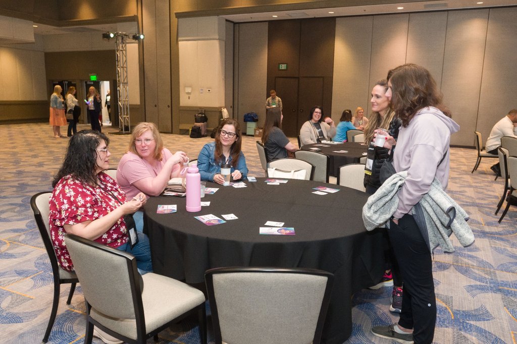 Exhibitors engaging with attendees during Day 5