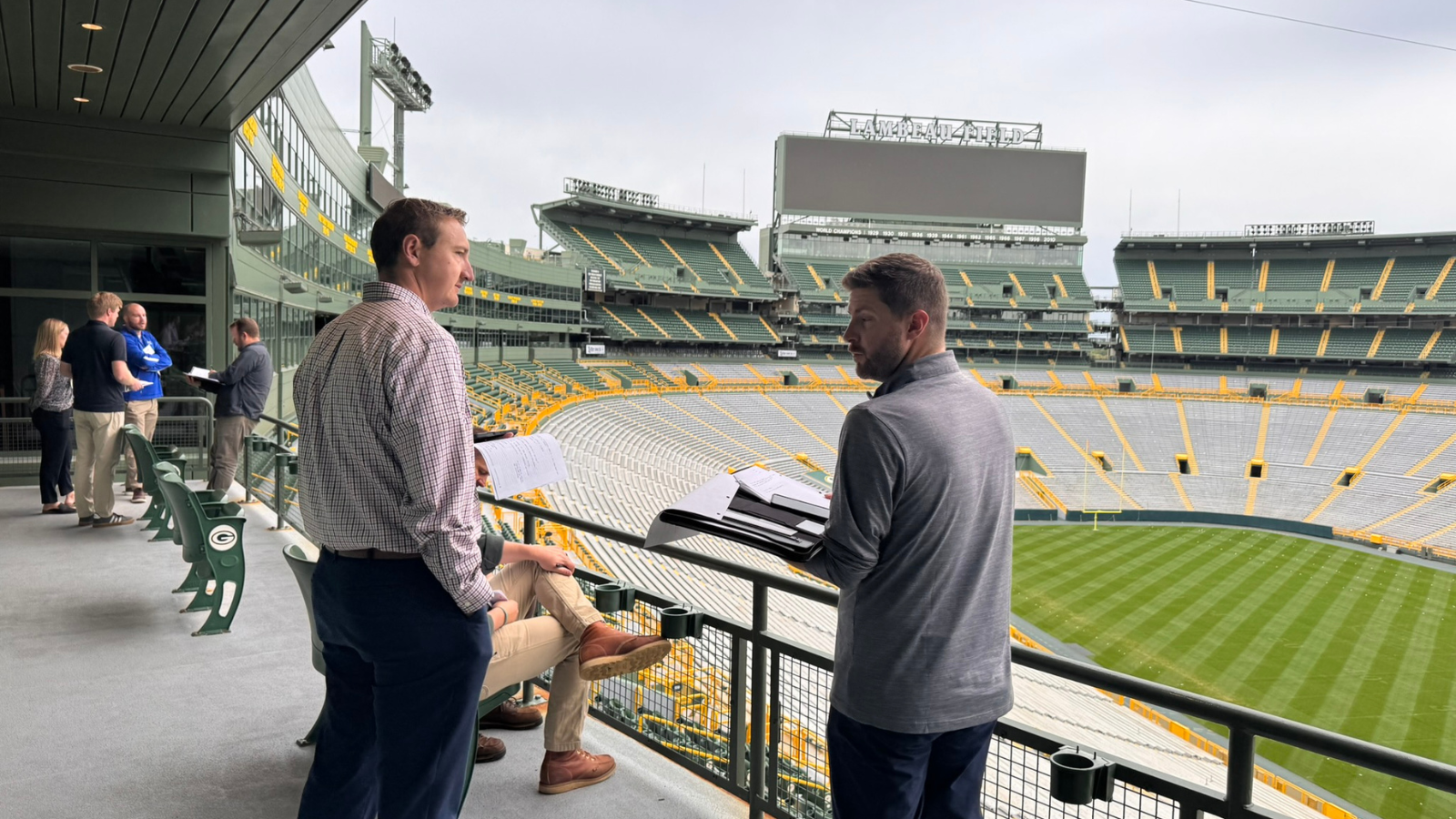 Members of the Class of 2027 connect during a break at Lambeau Field.