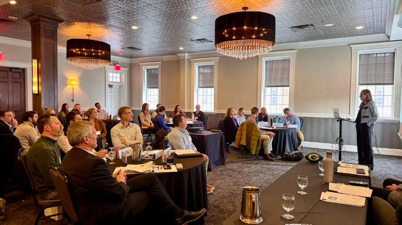 A room listens to the a risk management presentation