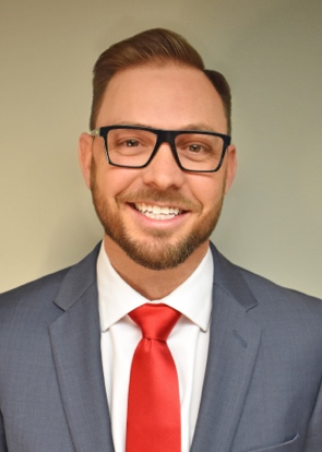 A person in a suit and tieAI-generated content may be incorrect.