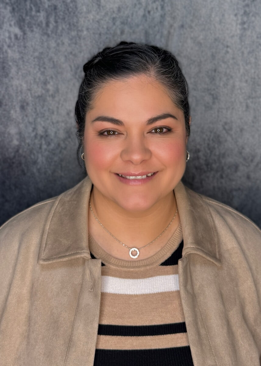 A person with blonde hair wearing a black vestAI-generated content may be incorrect.