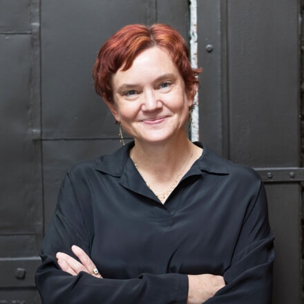 A person with red hair smilingAI-generated content may be incorrect.