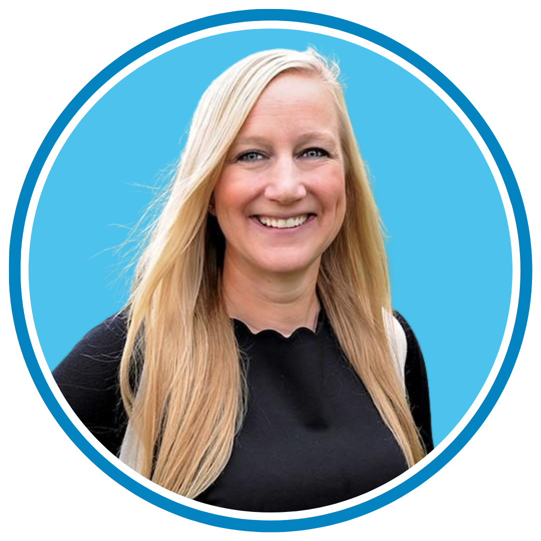 Smiling person with long blonde hair and wearing a black shirt