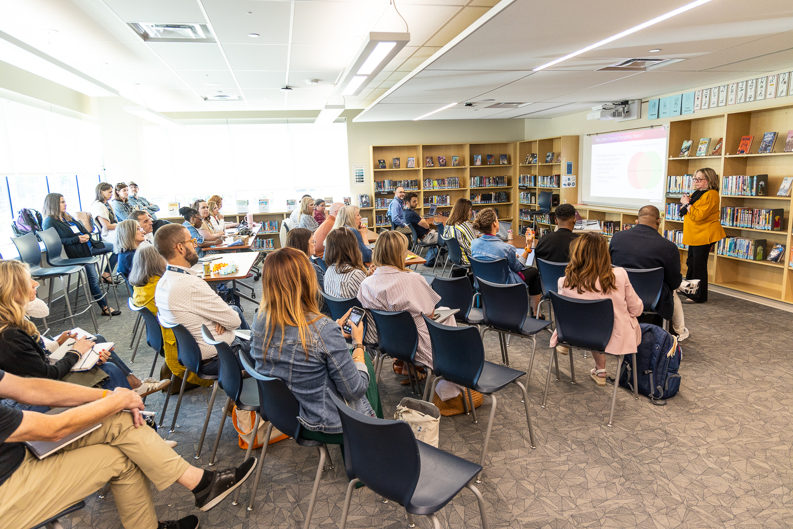 Attendees listening intently to a speaker during a breakout session