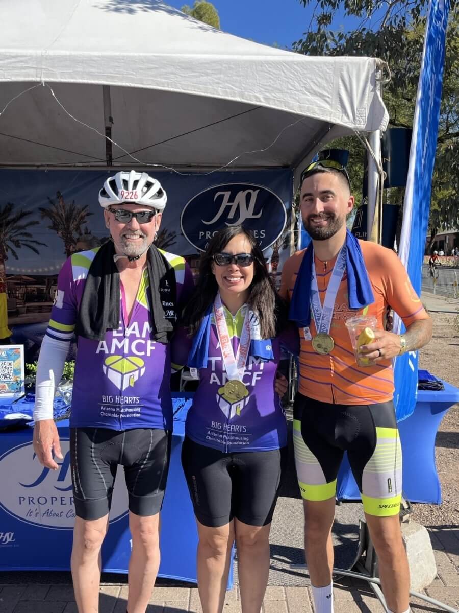 3 cyclists posing for a picture