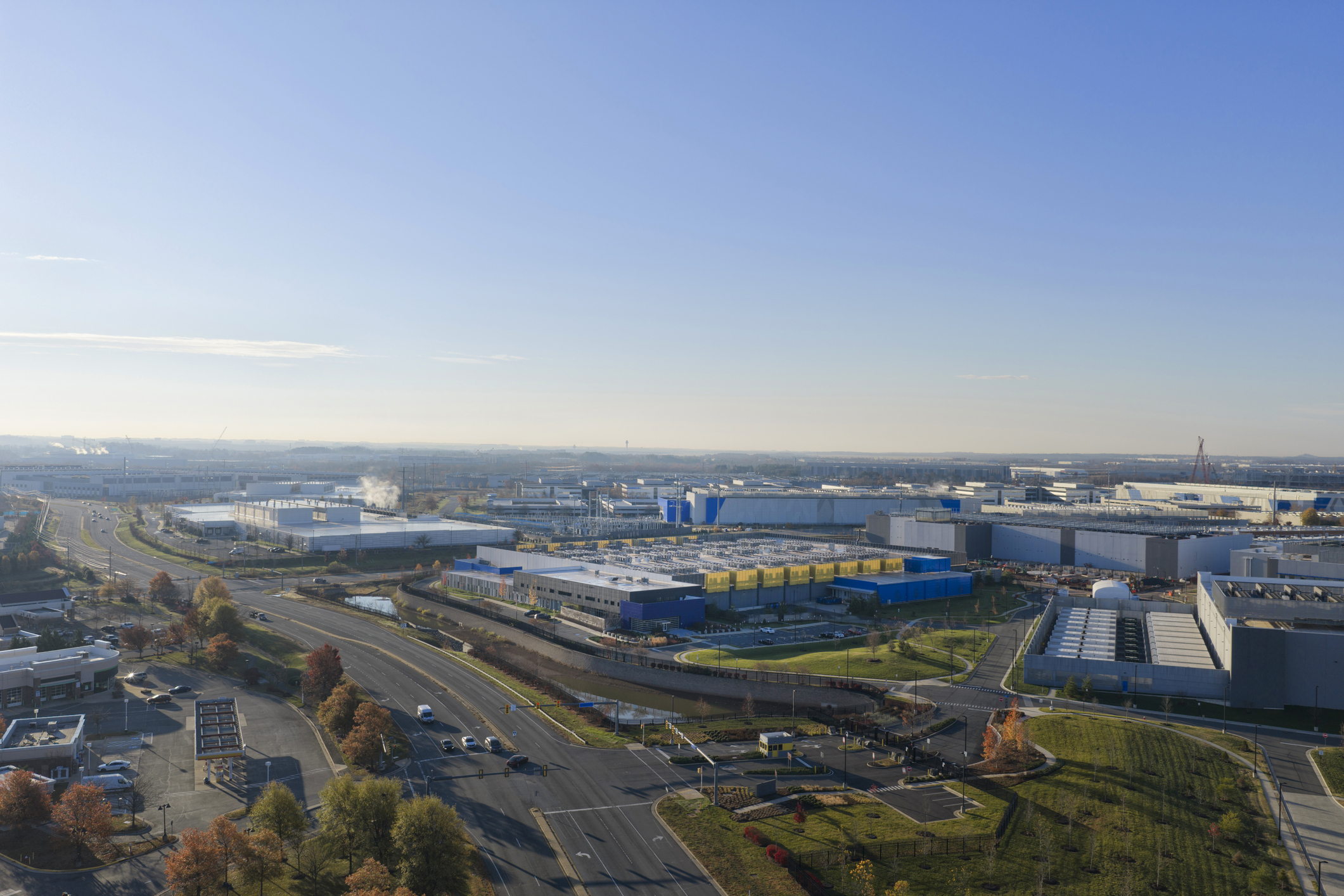 Aerial view of buildings and roads under a clear sky