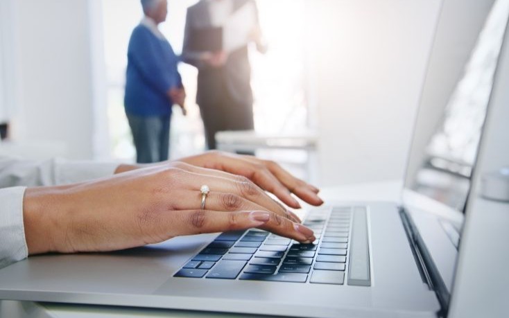 Hands typing on a keyboard