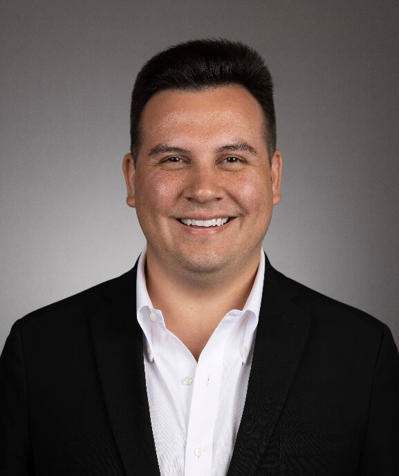 A person in a suitAI-generated content may be incorrect.