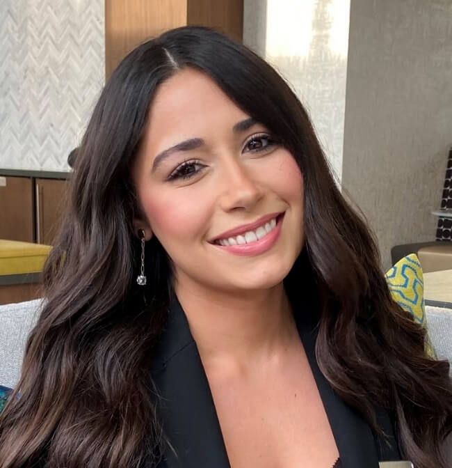 A person smiling at the cameraAI-generated content may be incorrect.