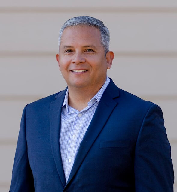 A person in a suitAI-generated content may be incorrect.