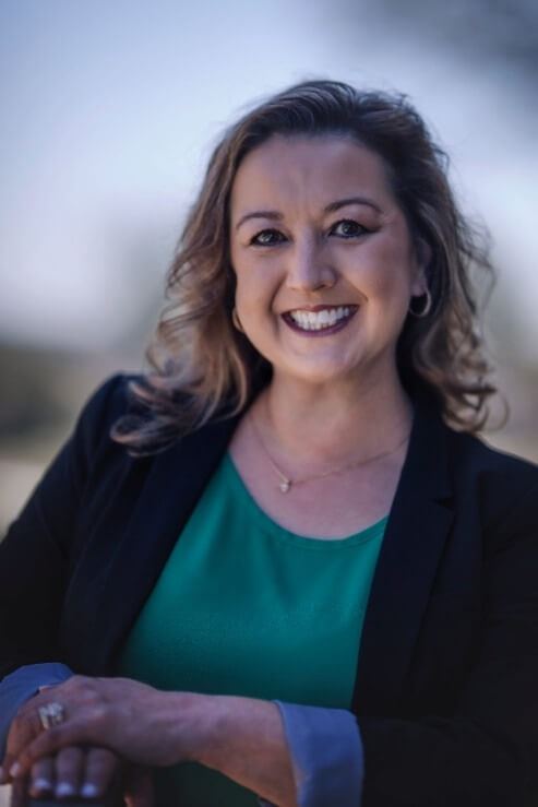 A person smiling at cameraAI-generated content may be incorrect.