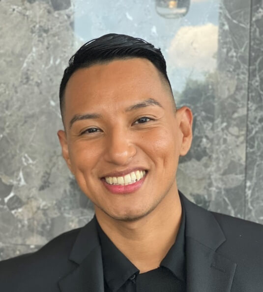 A person smiling at the cameraAI-generated content may be incorrect.