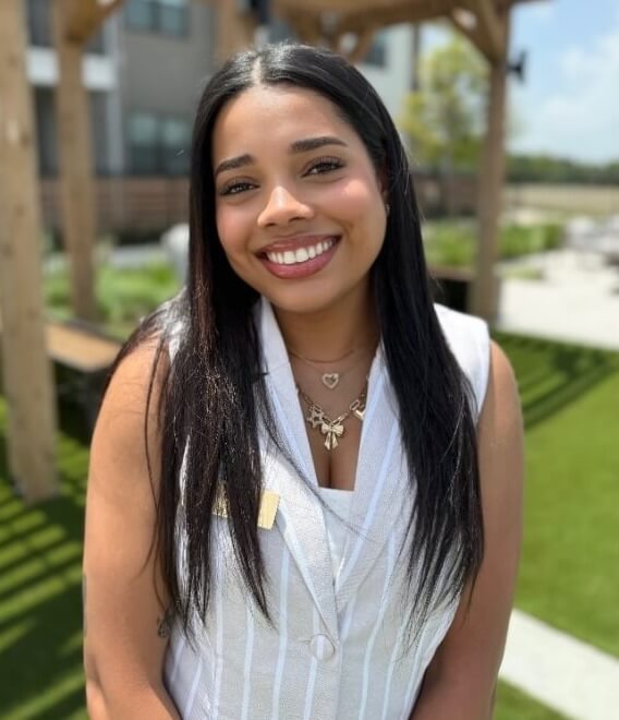 A person smiling at the cameraAI-generated content may be incorrect.