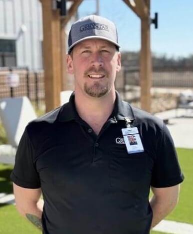 A person wearing a hat and a badgeAI-generated content may be incorrect.