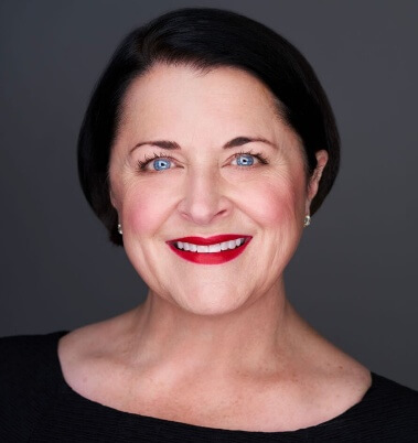 A person with red lipstick smilingAI-generated content may be incorrect.