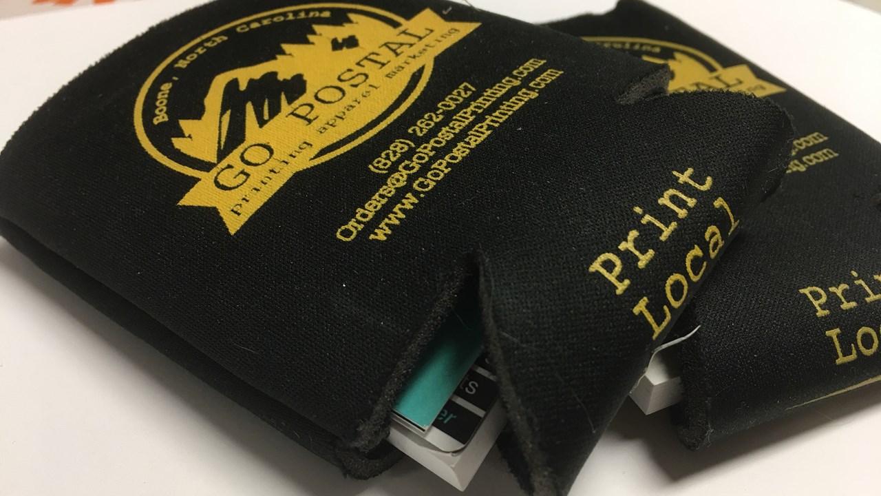 Koozies stuffed with Sticky Notepads, Magnetic Business cards and Coupons.