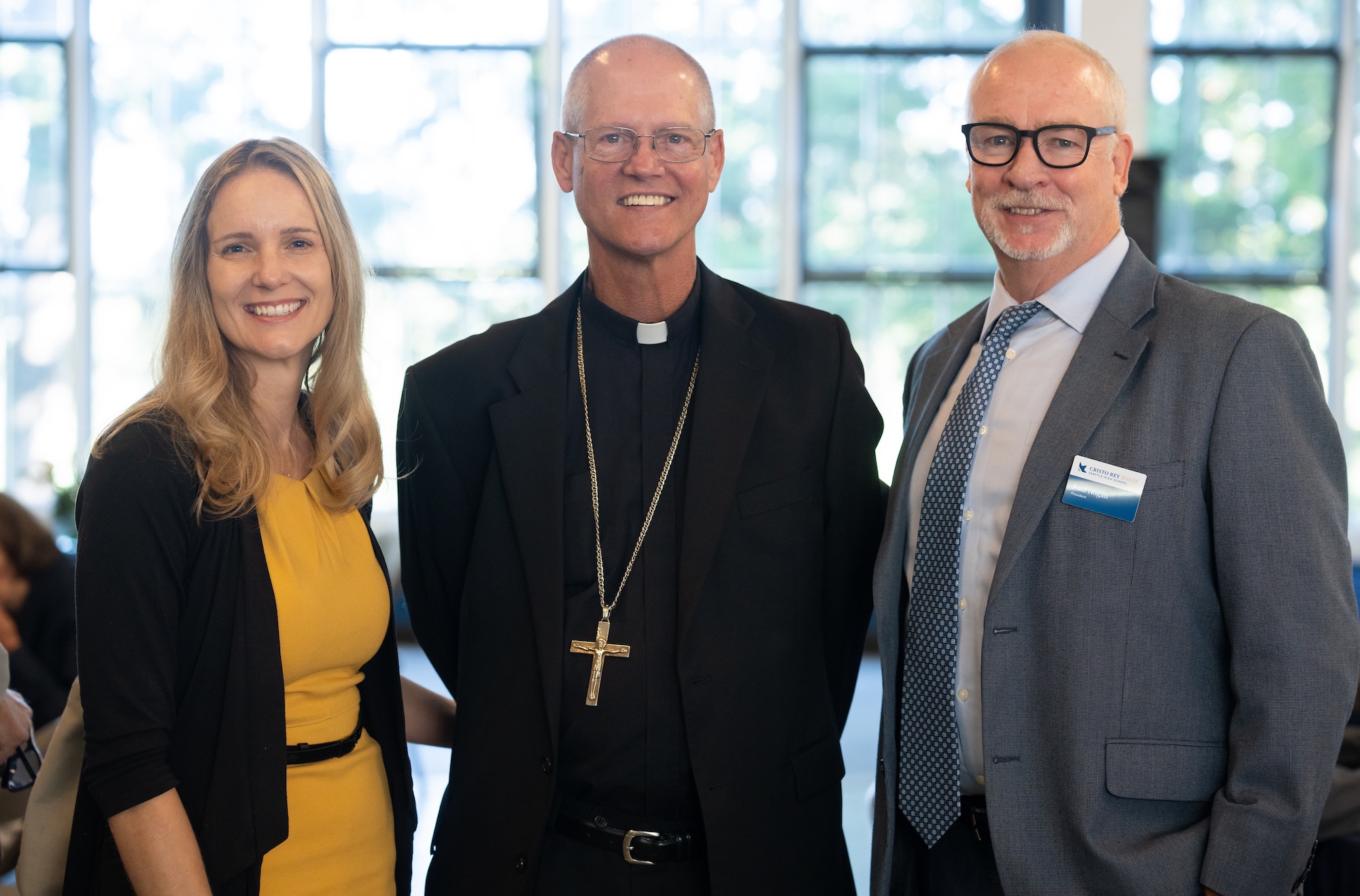 Helen McClenahan with Archbishop Paul D. Etienne and a Cristo Rey Seattle High School official