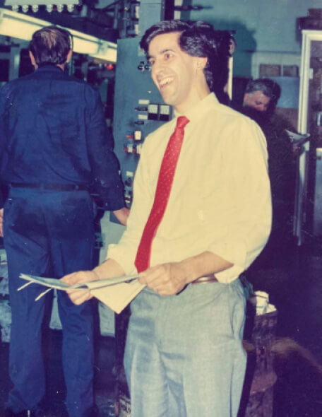 Mark Lombard, editor-in-chief of The Catholic Observer in Springfield, Mass., holds a just-printed issue as it rolls off the presses in 1989.