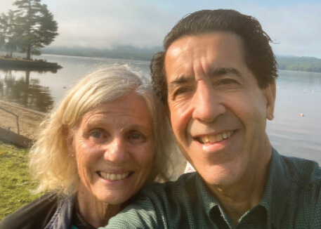 Mark Lombard and his wife, Mary Carty, met through their shared passion working in media. They enjoy a moment in Vermont by the Green Mountains they love.