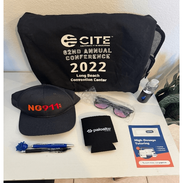 A black bag with white text and white text on it next to a black hat and sunglassesAI-generated content may be incorrect., Picture