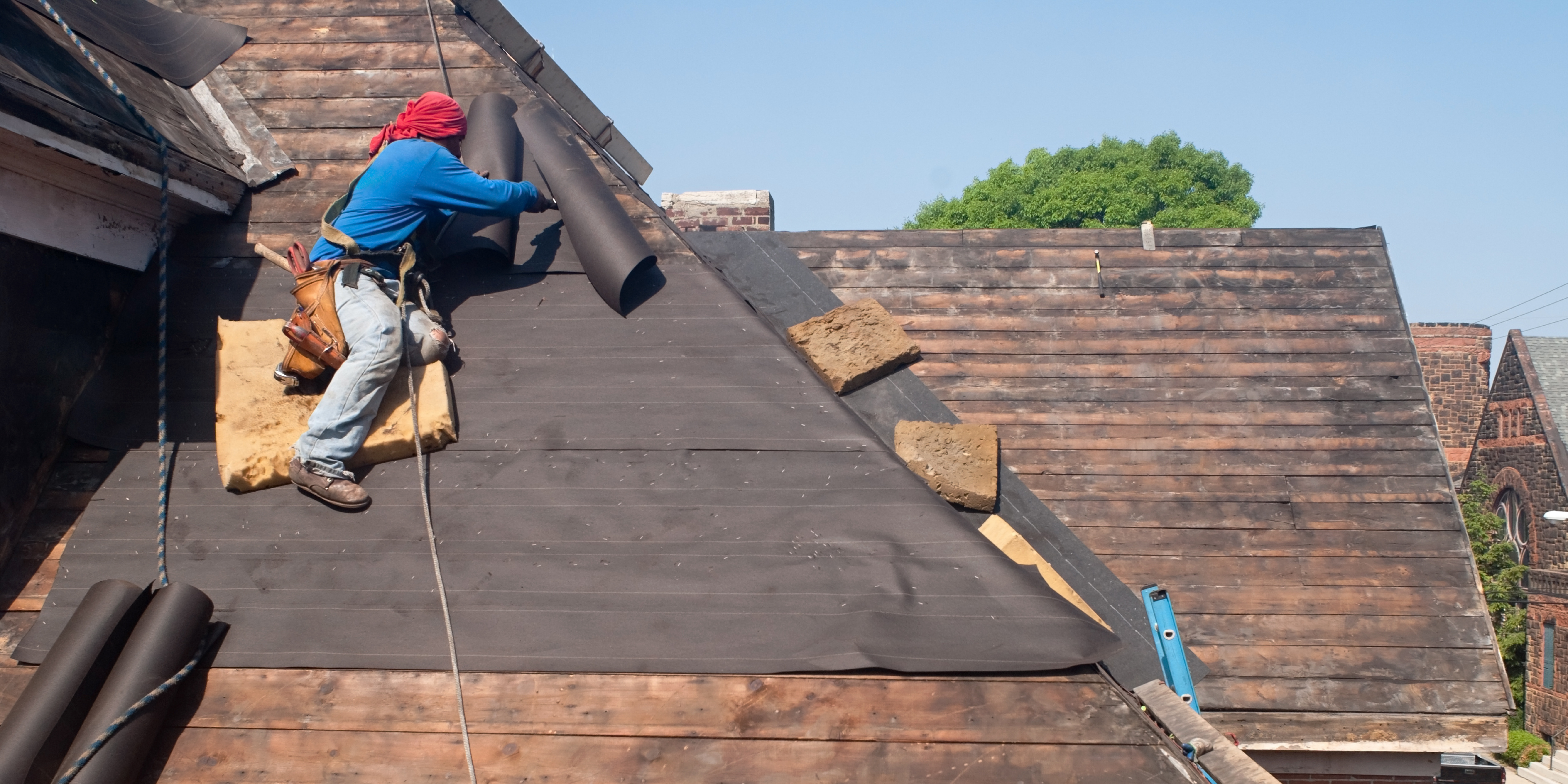 man working on a roof