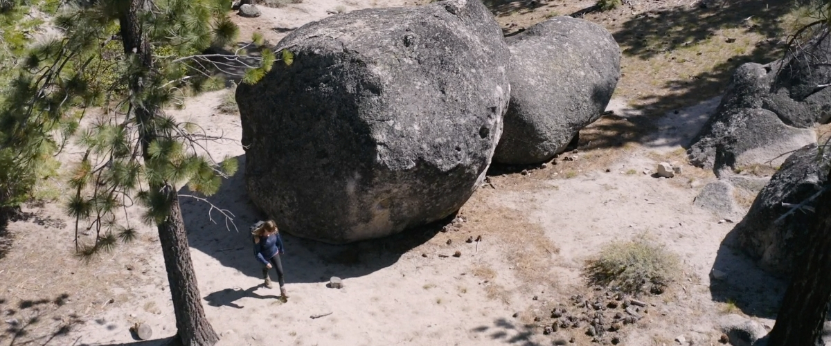 Woman walking in nature with crash pad