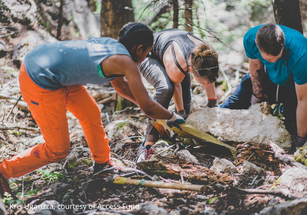 Climbers at outdoor climbing crag cleaning up