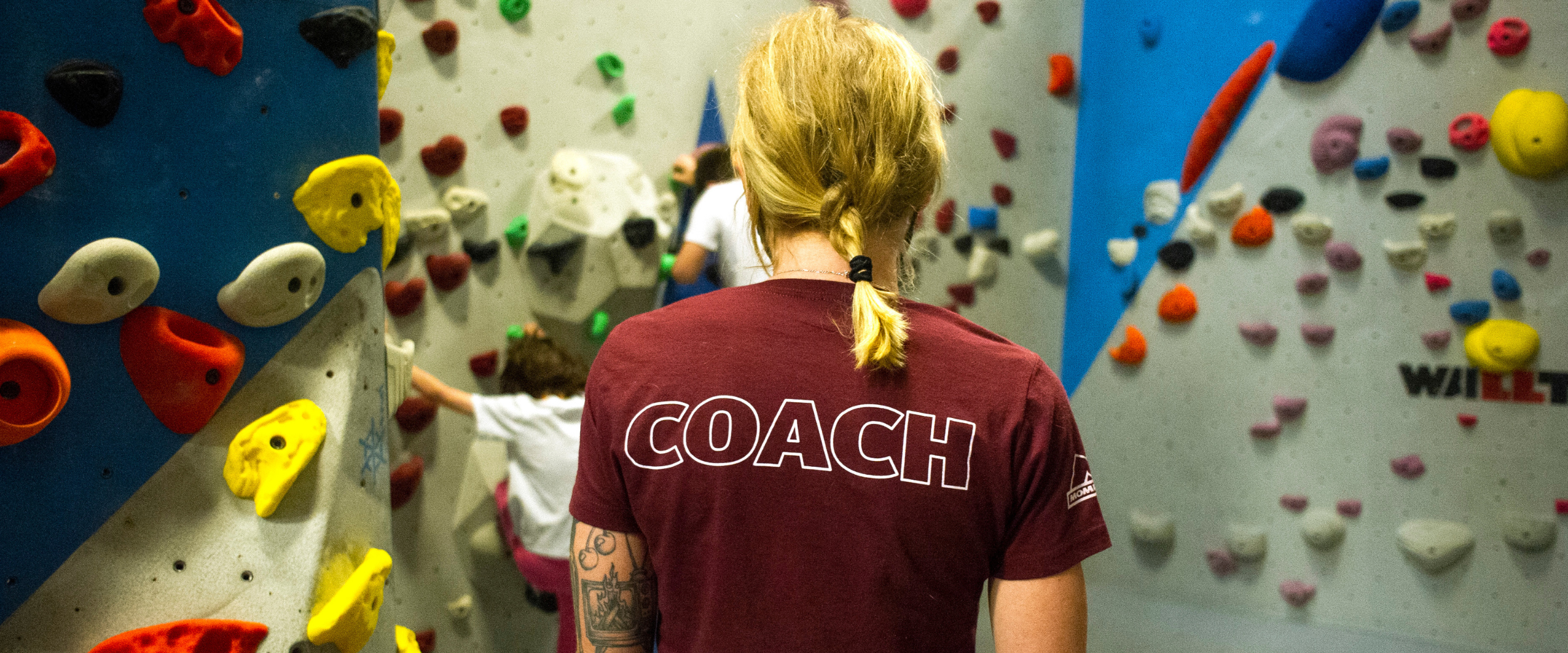 Coach at indoor climbing gym