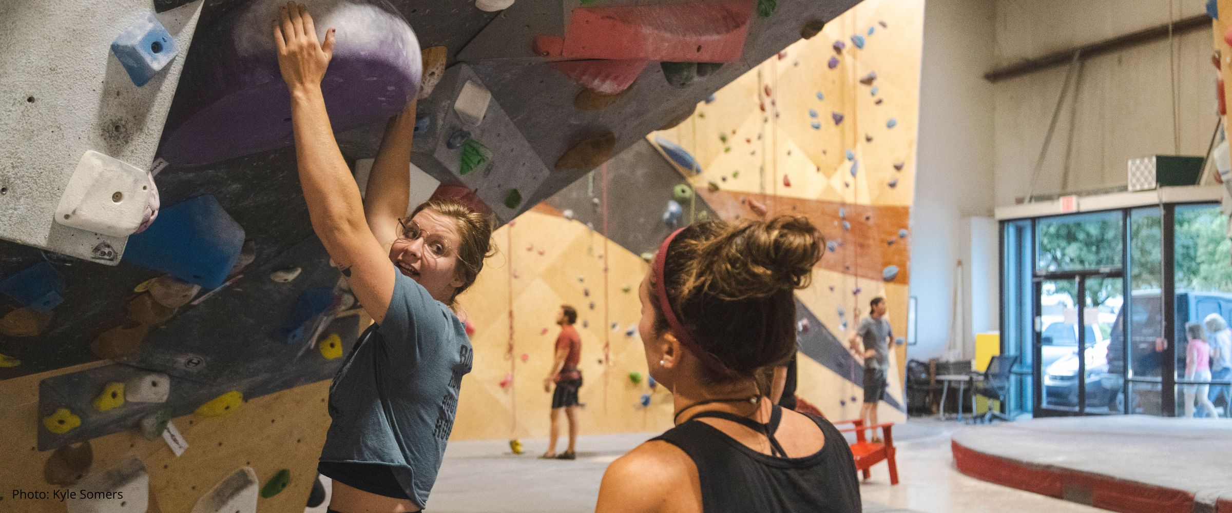 Hayley Moran instructing indoor climbing gym course