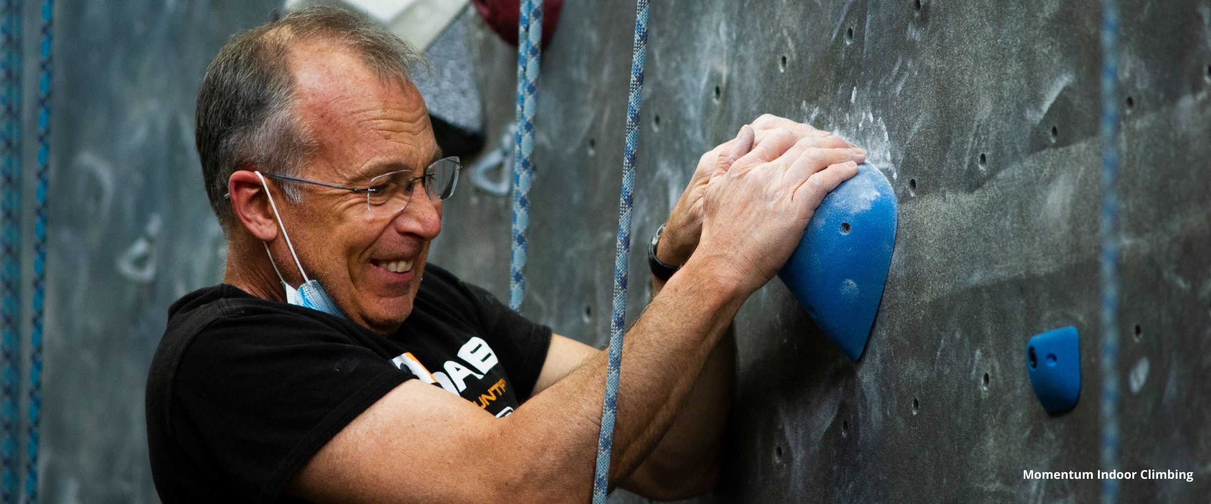 Person climbing in indoor climbing gym