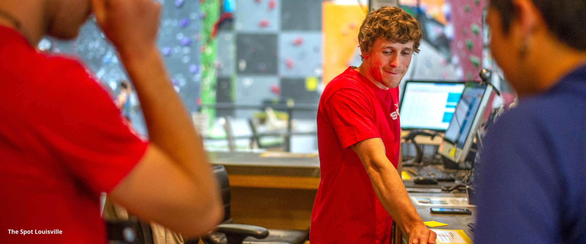 Employee in indoor climbing gym