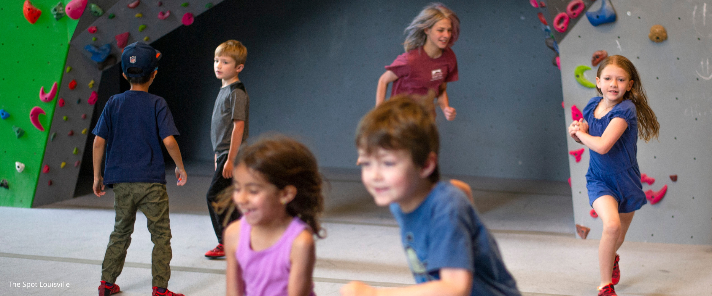 Youth inside indoor climbing gym