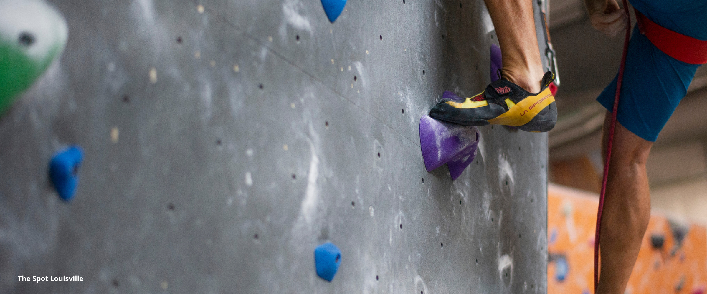 Person at indoor climbing gym climbing