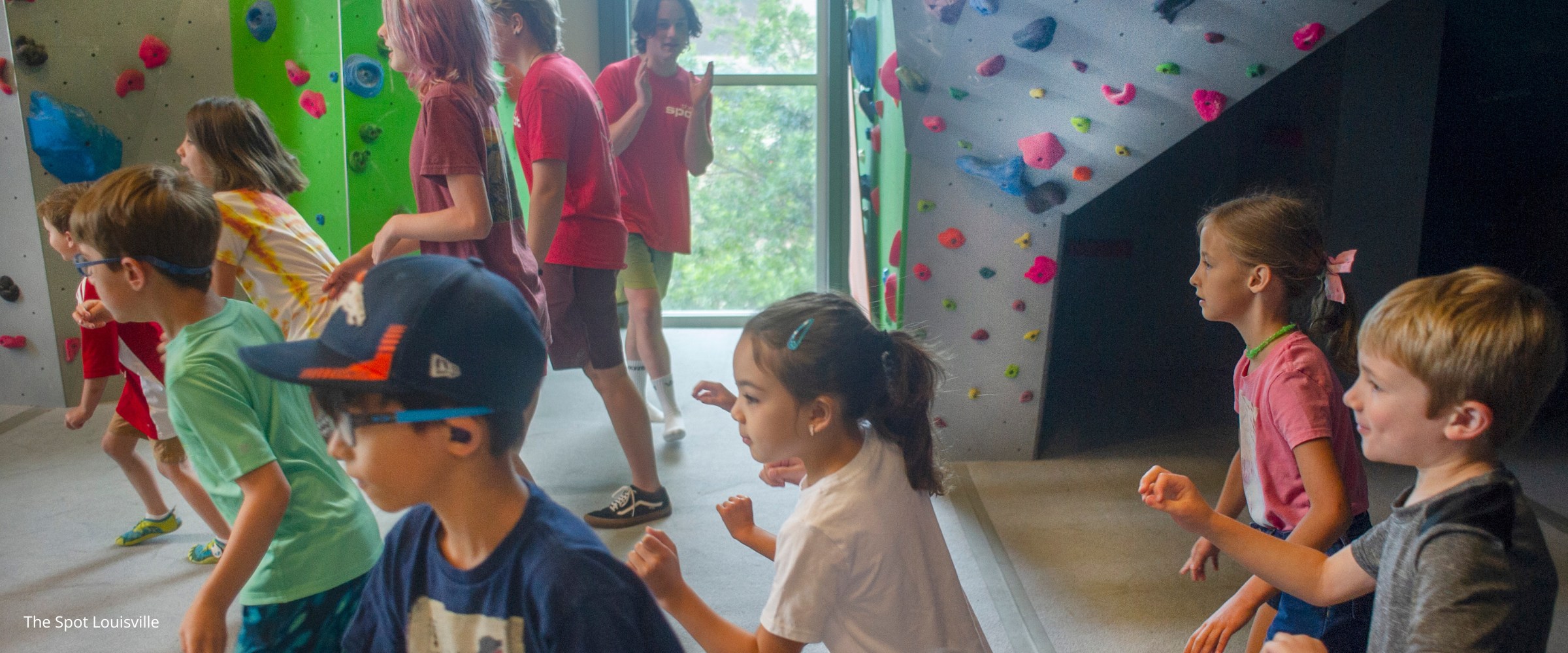 Youth inside indoor climbing gym