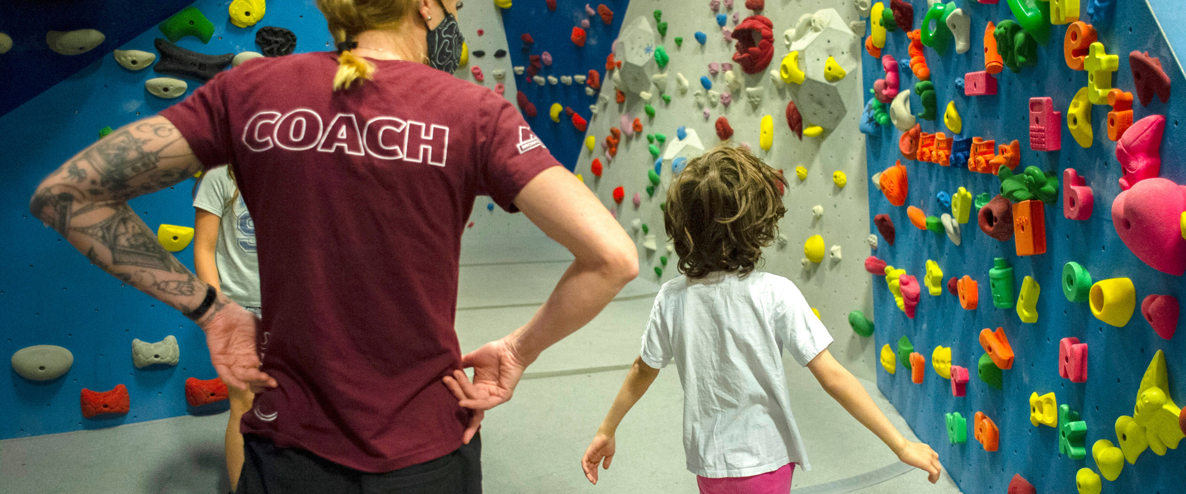 Kids in indoor climbing gym