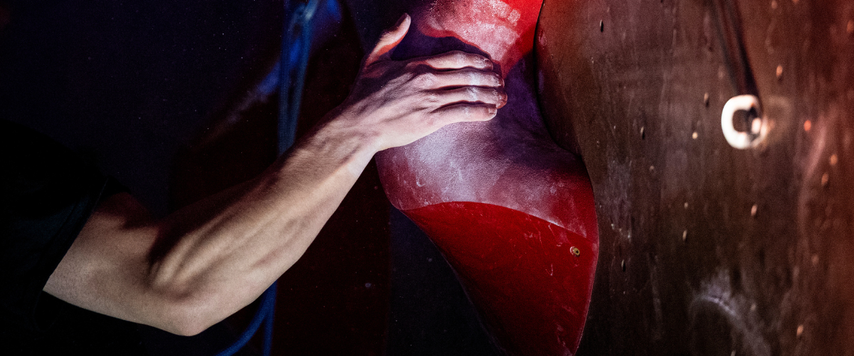 Person climbing in indoor climbing gym