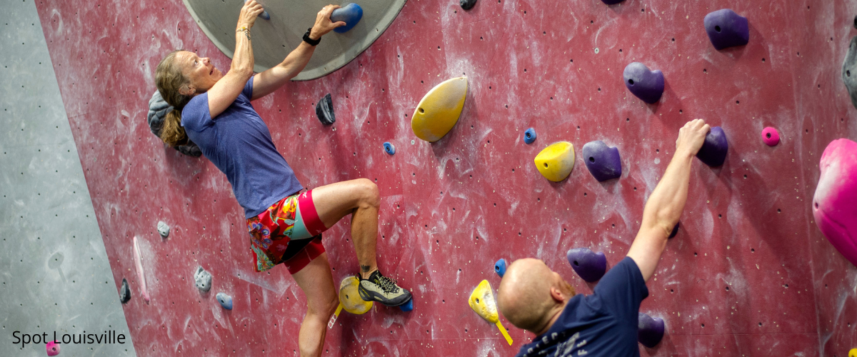 Folks climbing at an indoor climbing gym