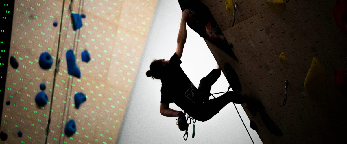 Person climbing in indoor climbing gym