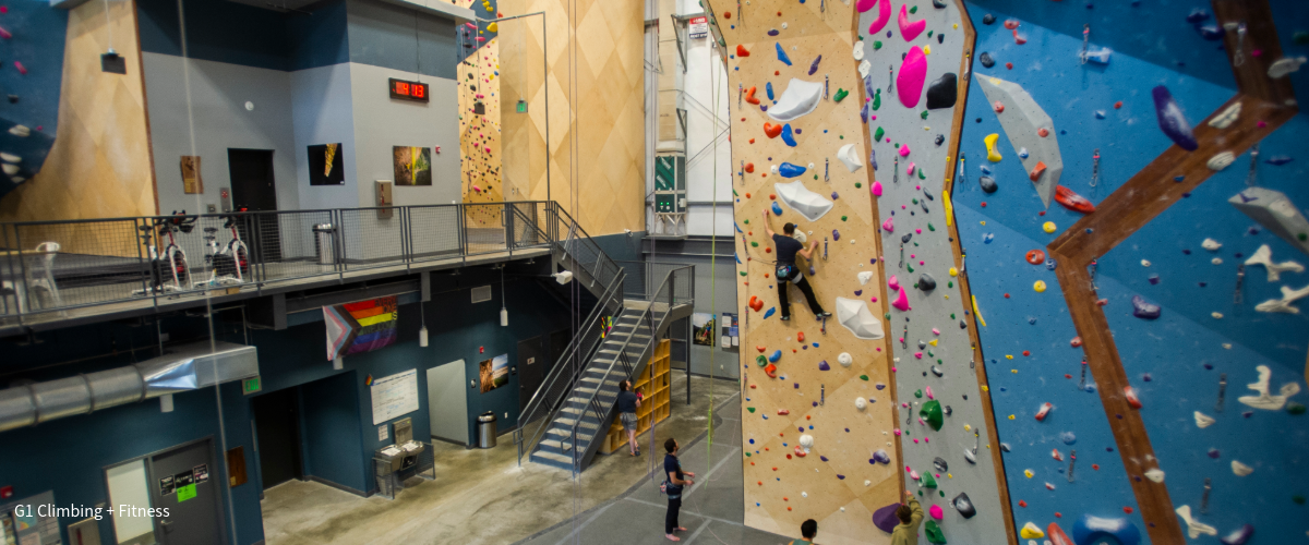 People climbing inside indoor climbing gym