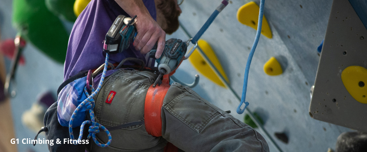 Routesetter in indoor climbing gym