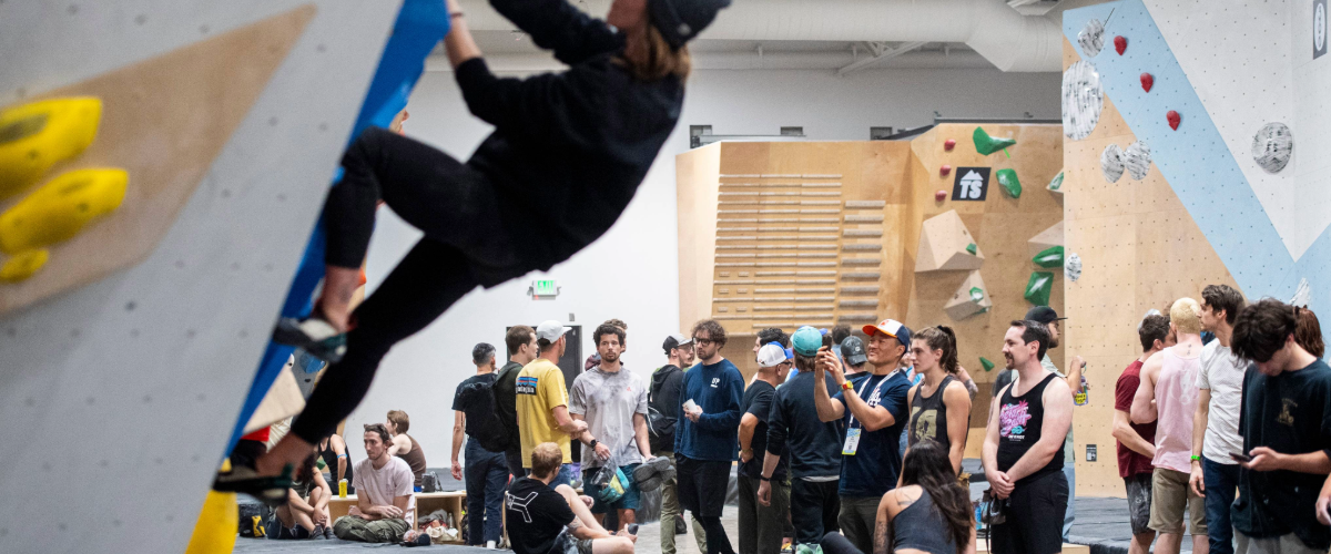 Person climbing inside indoor climbing gym