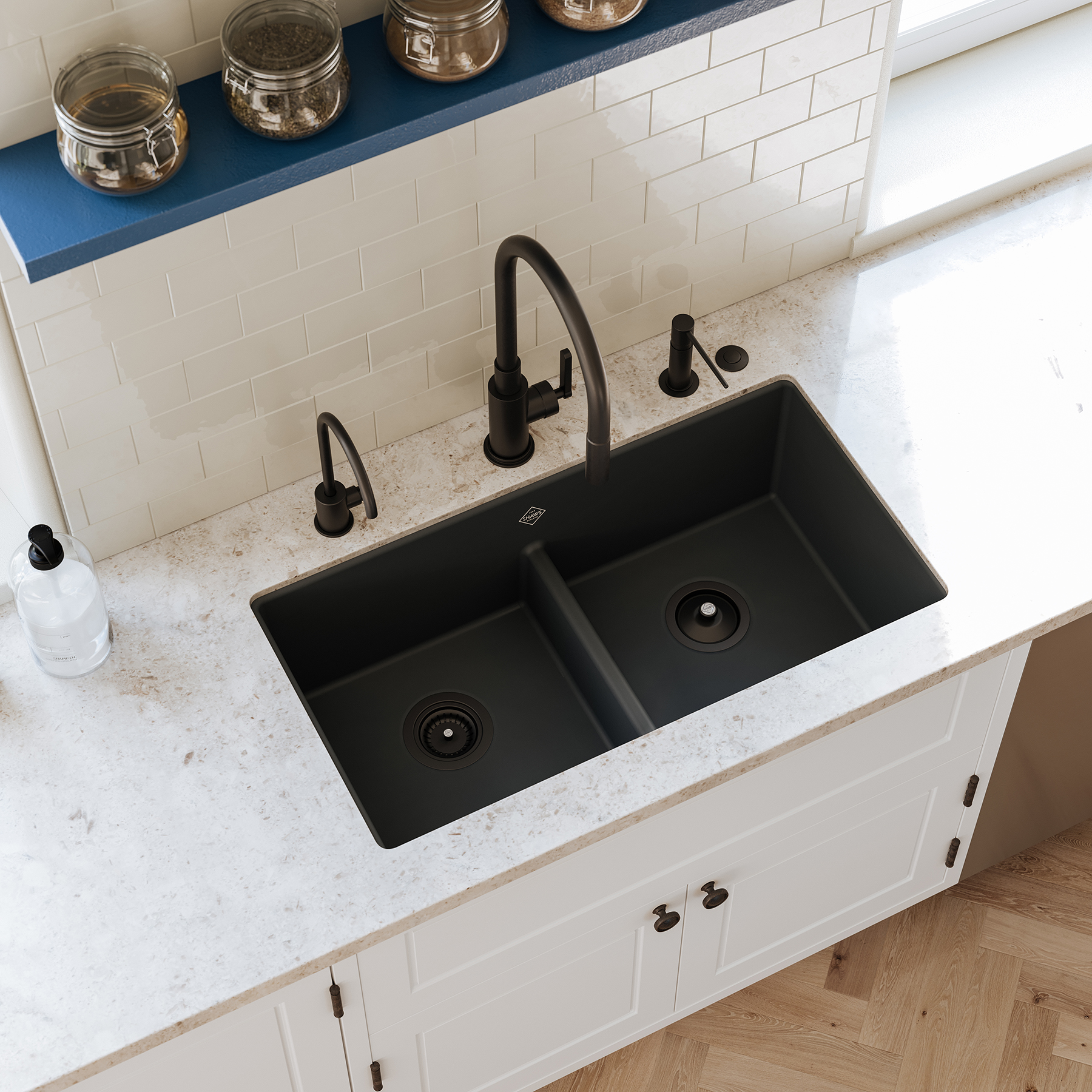 Black kitchen faucet and sink with white counter viewed from above