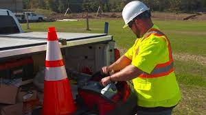 A person in a safety vest and hardhatAI-generated content may be incorrect.