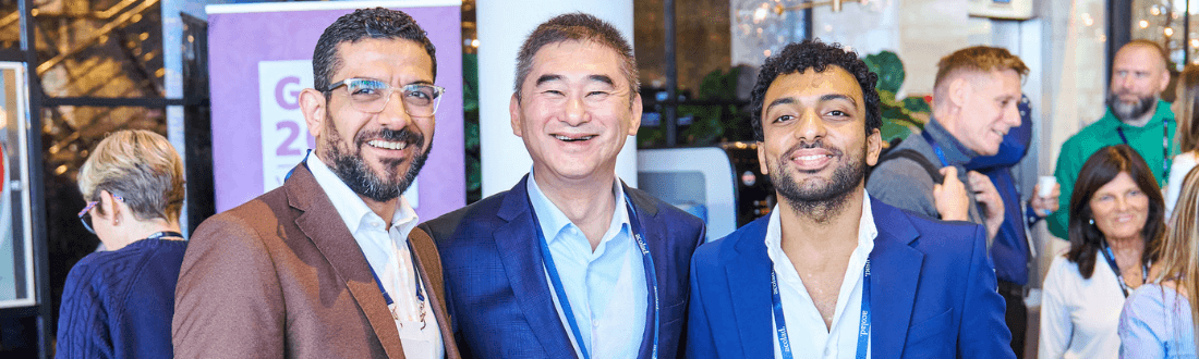 Group of 3 individuals smiling at camera at GALA event