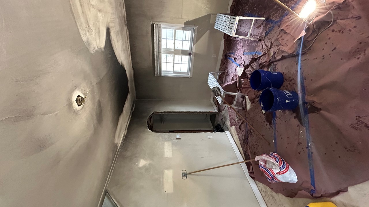 Wall wash — removing smoke residue before primer.