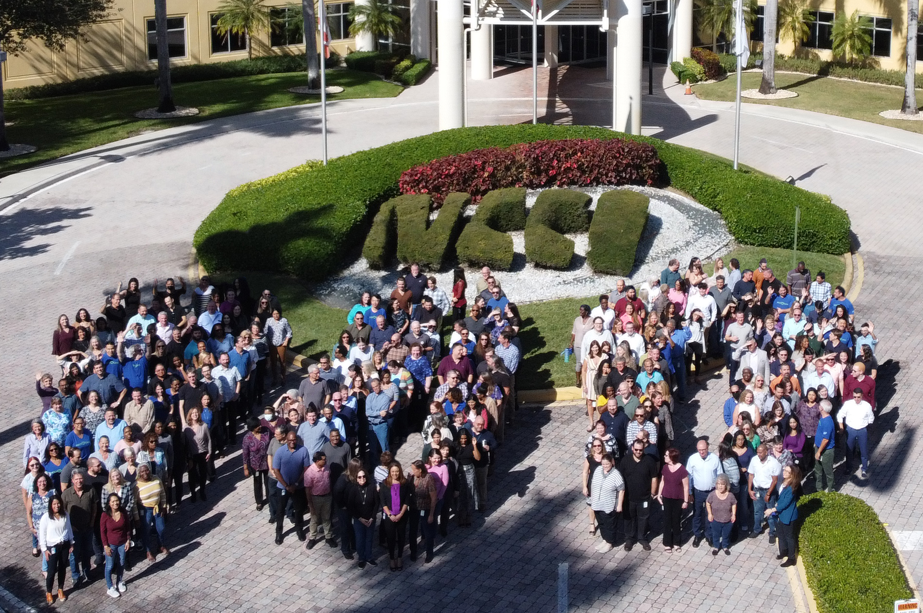 NCCI employees gather for a live 100th photo to kick off their centennial celebration.